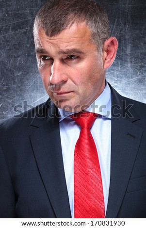 side view of an old business man\'s face looking away from the camera