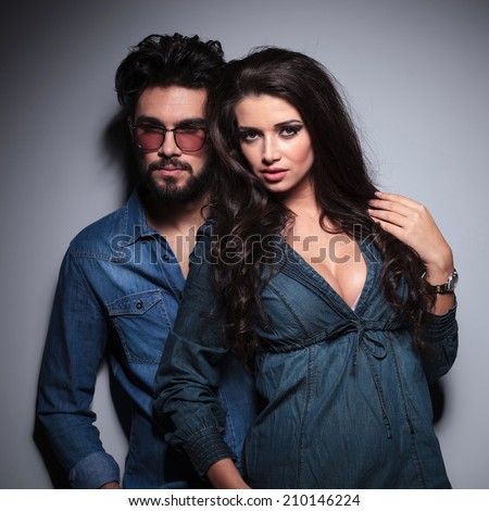 dramatic couple looking at the camera in studio