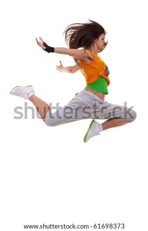 stylish and young modern style dancer is posing in an energy jump