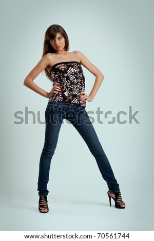 picture of a fashion model girl in jeans and high heels posing
