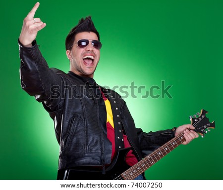 heavy metal guitarist making a rock and roll gesture while screaming and playing