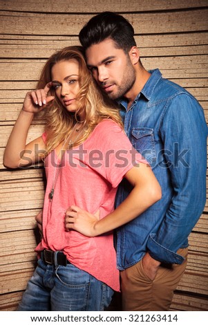 man leaning his head on his girlfrends shoulder while she is scratching her head