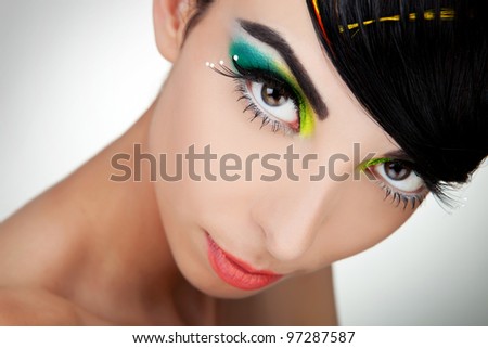 Woman face with beautiful makeup closeup picture