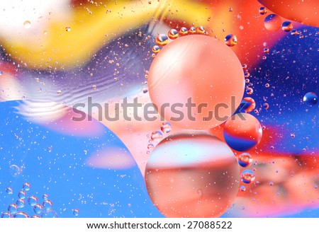 Micro photo of oil droplets and water on a colorful background