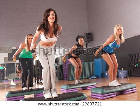 a group of friends in a step fitness class