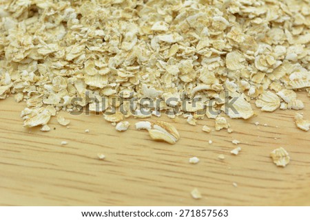 Oat on wood board, Oat a cereal plant cultivated chiefly in cool climates and widely used for animal feed as well as human consumption. Best for healthy and breakfast is good.