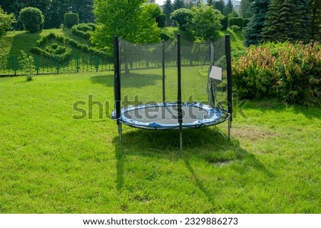 Similar – Image, Stock Photo Trampoline on a lawn in the sunset with two kids