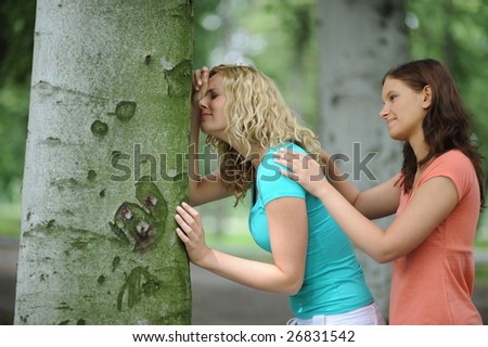 Young woman consoling her crying friend