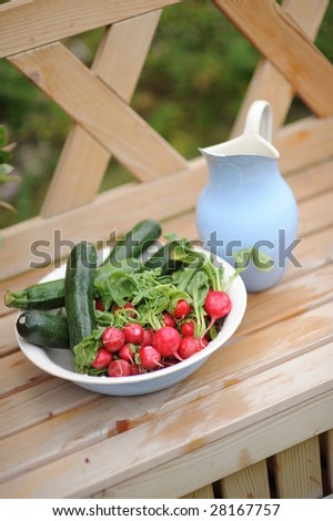 bowl of vegetables and jug
