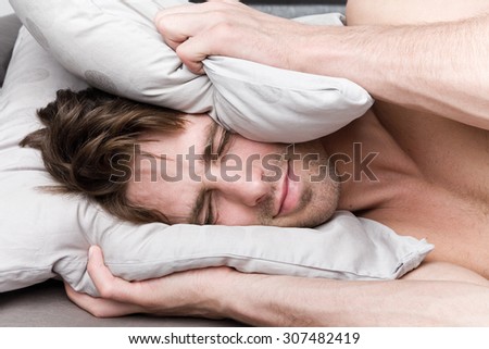 Young attractive man wakes up
