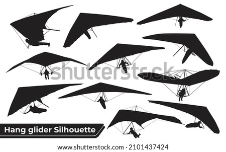 Black Silhouettes Hang Glider or Parachute skydiving