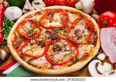 Pizza with meat and pepper