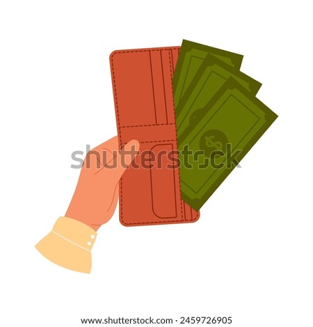 Hand holds brown wallet with green paper money. Purse with paper currency. Wallet filled with money