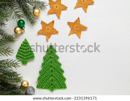 Similar – Image, Stock Photo Knitted Christmas tree, New Year baubles, xmas sock, snowflakes on light background  in minimal style. Decorative Christmas ornaments, new year and winter concept with copy space.