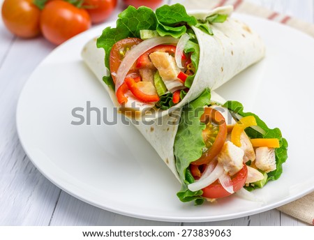 Similar – Image, Stock Photo Tortilla wraps sandwiches preparation with tasty fresh avocado salsa salad on white background, top view. Healthy food.  Vegetarian lunch or snack