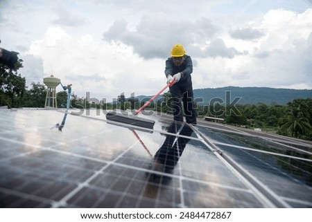 Similar – Image, Stock Photo Man cleaning solar panel on roof. Solar panel or photovoltaic module maintenance. Sustainable resource and renewable energy for go green concept.  Solar power for green energy. Technology for future.