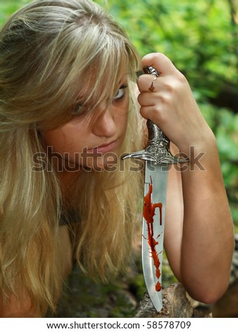 portrait blonde with dagger in blood
