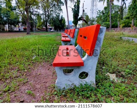 Old empty isolated cement bench in a park.