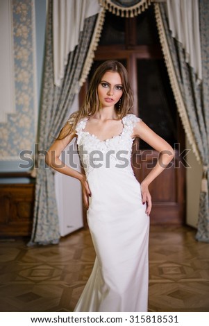 Portrait of beautiful bride with long hair and fashion make up
