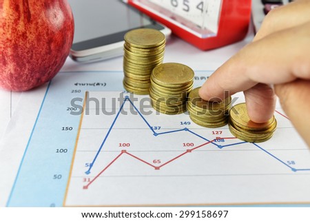 Women hand with apple, money,clock, telephone and calculator placed on document., concept for business