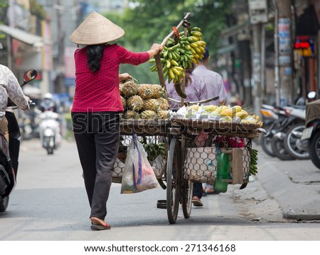 NAMDINH, VIETNAM - April 18, 2015: Unidentified vendor at the small market on April 18, 2015 in NAMDINH, VIETNAM. This is a small market on street of VIETNAM.