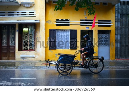 Nam Dinh, VIETNAM - August 2, 2015: Life in the old town of Minh Khai street, Nam Dinh City after the rain at August 02, 2015. Namdinh city is located in the south than the capital Hanoi, Vietnam.