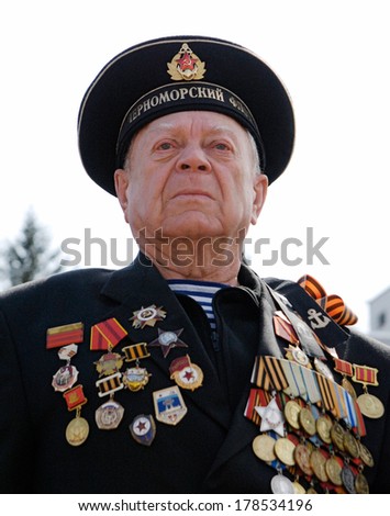 ULAN-UDE, RUSSIA - MAY 9, 2008: An unknown sailor veteran of WWII watches the parade on annual Victory Day.