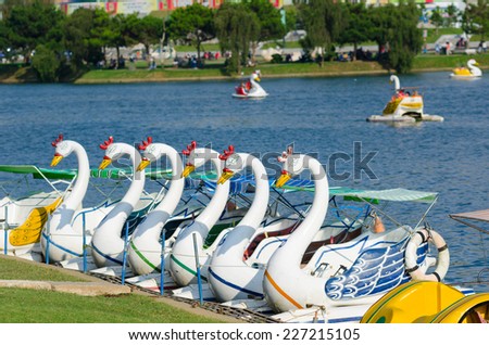 DALAT, VIETNAM - JUNE 8, 2014: A swan catamaran station at Xuan Huong Lake. This artificial lake in the city centre is a favourite place for tourists and locals for walking.