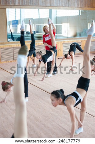 ULAN-UDE, RUSSIA - APRIL 28, 2011: Trainer Svetlana Bogatykh coaches girls in Gratsia rhythmic gymnastics studio, City Palace of Childrens Arts, the biggest centre offering childrens hobby circles.