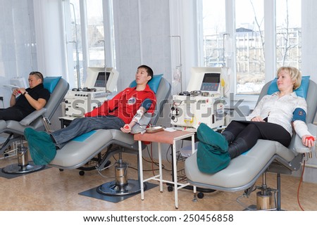 ULAN-UDE, RUSSIA - APRIL 6, 2010: Unidentified volunteers donate blood at the City Blood Service which makes a promo action for donorship popularization.