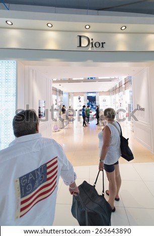 BANGKOK - MARCH 18; 2015: Unidentified people shop at a duty free Dior boutique at the International Airport Suvarnabhumi which is the sixth busiest airport in Asia.