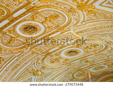 ST. PETERSBURG - JUNE 30, 2011: Gilt stucco ceiling in the Hermitage. One of the worlds largest and oldest museums, it was founded in 1764 by Catherine the Great and was open to the public in 1852.