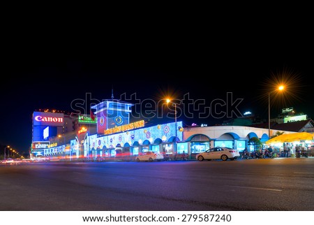 HO CHI MINH, VIETNAM - MARCH 25, 2015: The Ben Thanh Market facade with night illumination. While tourists search here souvenirs townspeople come to buy fresh food.