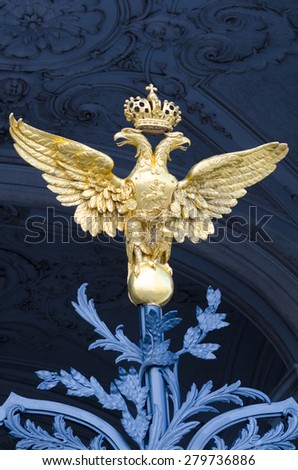 ST. PETERSBURG - JUNE 30, 2011: One of three golden double headed eagles at forged gate at Southern facade of the Winter Palace. From 1732 to 1917 it was the official residence of Russian monarchs.