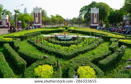 BANGKOK, THAILAND - FEB 17: A large clock of trimmed bushes in Lumpini Park, Feb 17, 2013, Bangkok, Thailand. Bangkok was the third most visited city in the world in 2012.