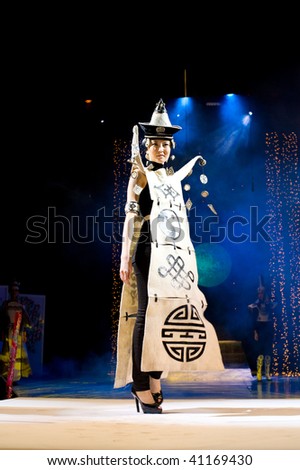 ULAN-UDE, RUSSIA - OCTOBER 29: An asian model demonstrates a dress in ethnic style at the international asian fashion festival on October, 29, 2009 in Ulan-Ude, Buryatia, Russia.