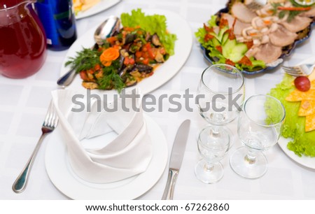 served dinner for one person at laid restaurant banquet table