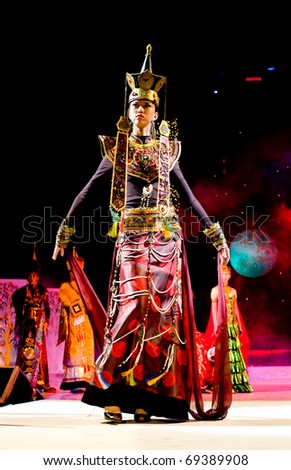 ULAN-UDE, RUSSIA - OCTOBER 29: A model wears an ethnic style dress at the International Asian Fashion Festival on October, 29, 2009 in Ulan-Ude, Buryatia, Russia.