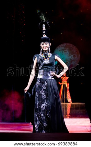 ULAN-UDE, RUSSIA - OCTOBER 29: A model wears an ethnic style dress at the International Asian Fashion Festival on October, 29, 2009 in Ulan-Ude, Buryatia, Russia.