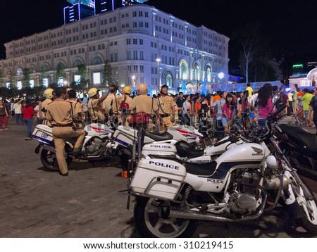 HO CHI MINH, VIETNAM - APRIL 30, 2015: Officers of traffic police work on Victory Day in the downtown. The nation celebrates the 40th anniversary of the end of the Vietnam war.