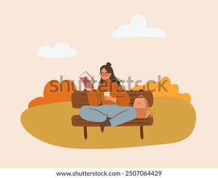 Cute latino woman in glasses reading outdoors.