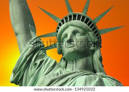 New York\'s Statue of Liberty with Sunrise Sky.