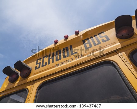 Detail of typical school bus signage in bright afternoon light.