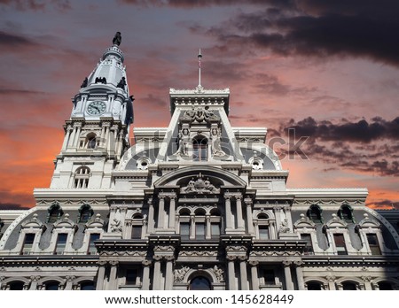Philadelphia\'s landmark historic City Hall building with sunset sky.