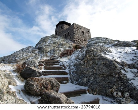 Snowy stone stairs at the Harney Peak Fire Tower in the Black Hills National Forest.