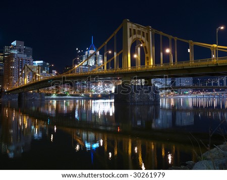 Pittsburgh skyline, Ohio River and bridges at night.