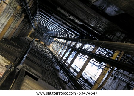 View up an old freight elevator shaft.