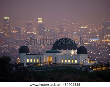 Visitors flock to Los Angeles\'s city owned Griffith Park Observatory on a slightly foggy night.