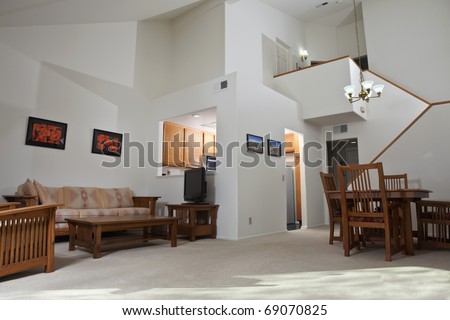 Sunny California townhouse style condo living room.  The wall art (photos) are the photographer\'s work and are included in the release.