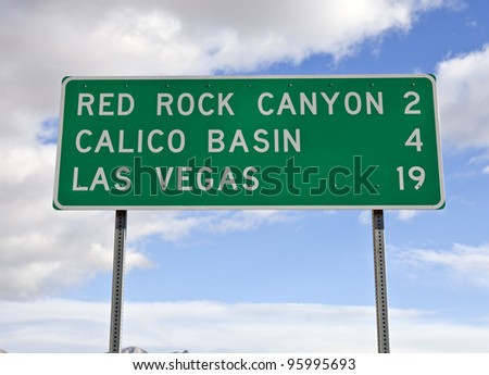 Green highway sign showing the back way into Las Vegas Nevada.